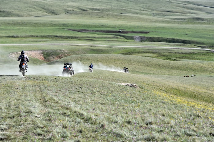 Kyrgyzstan tours, Bike tour. Tradition clothes.